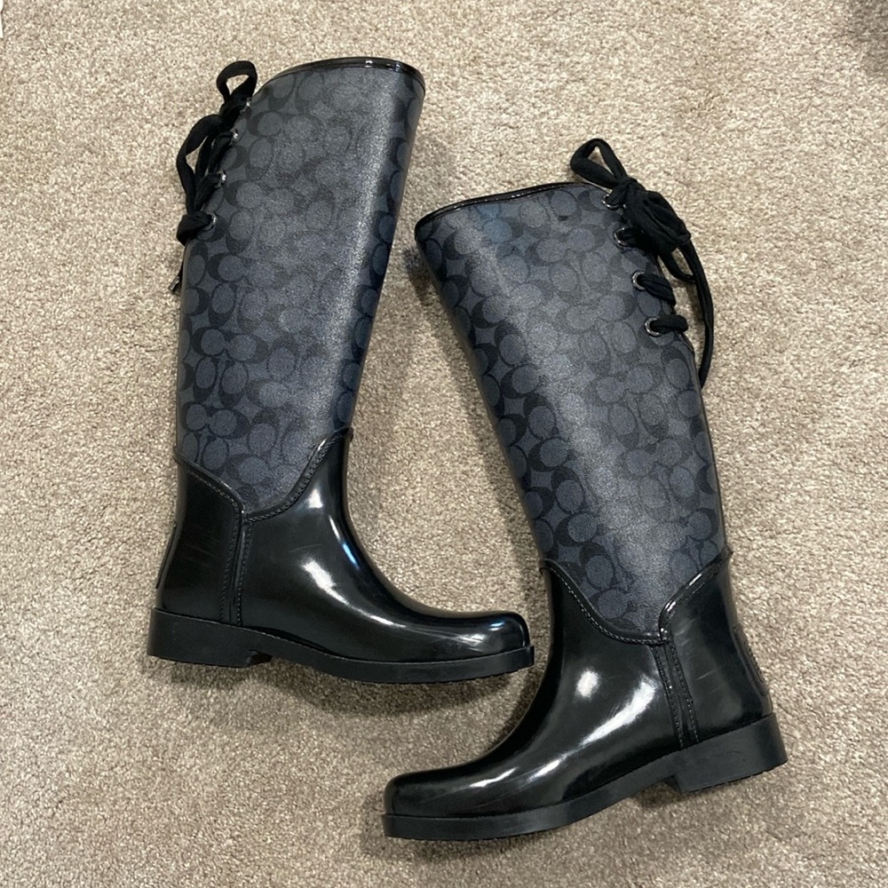 Black coach rain boots with lace details